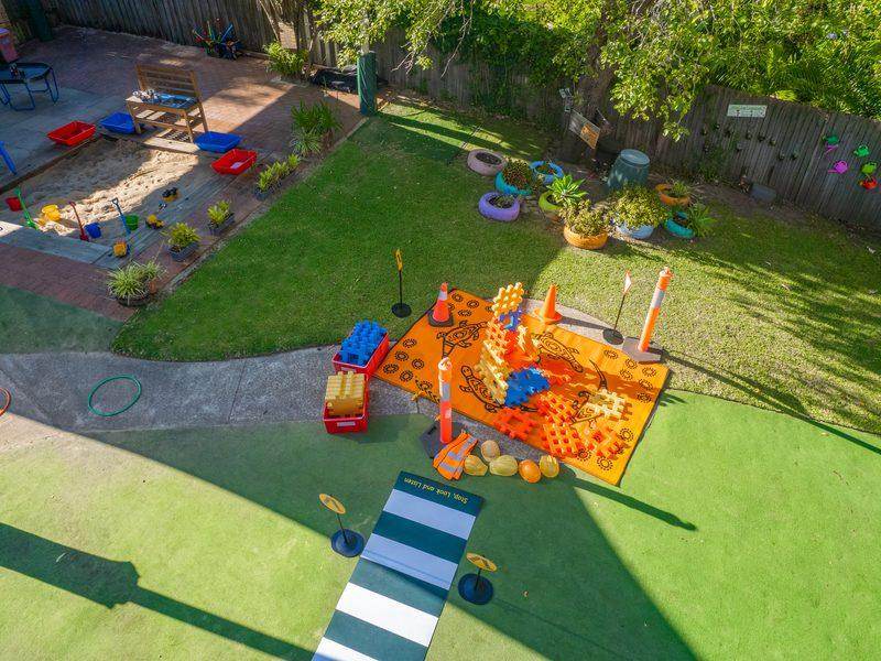 Aerial view of the St Ives Chase outdoor space showing the cubby, garden beds, construction zone and lawn area